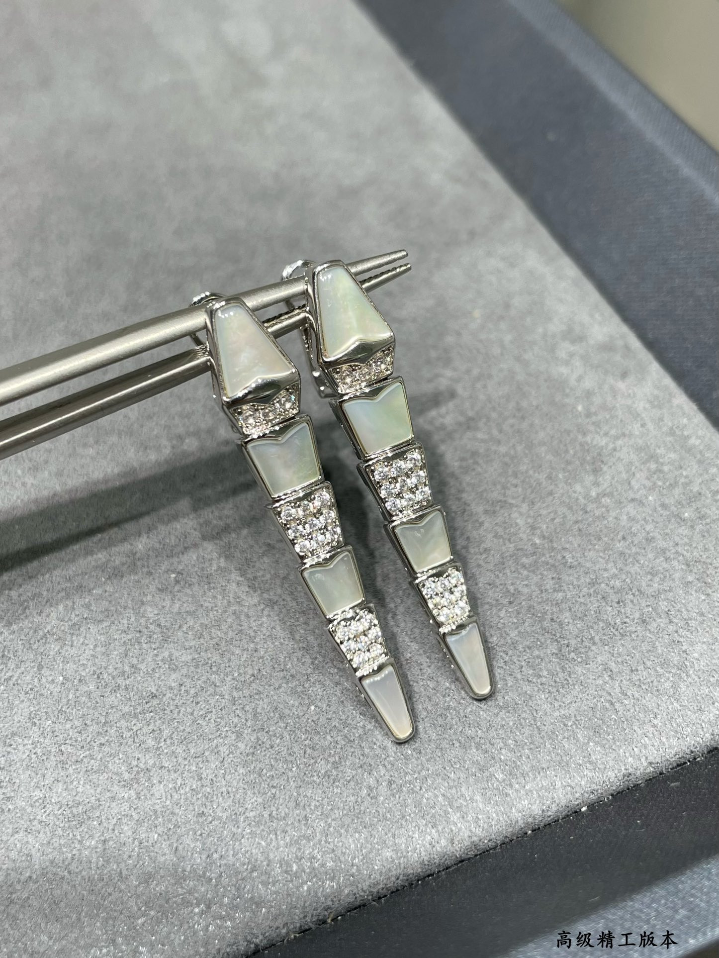 B*l*ai advanced mechanical shell snake earrings