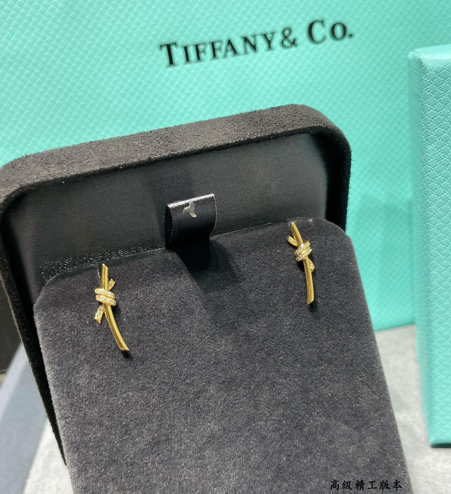 t*f*ny & co. half-Di*m*nd t wire knot stud earrings