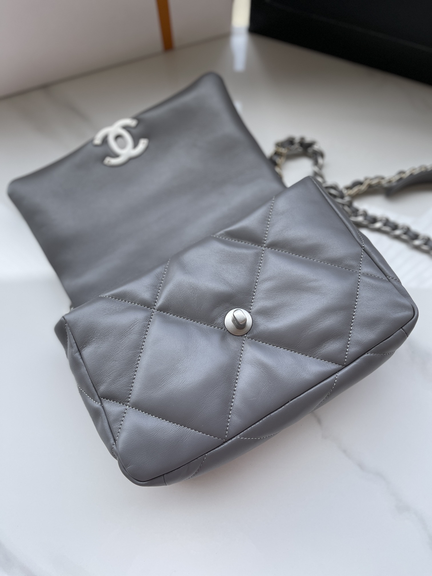Ch*el 19 handbag shiny leather, gold-tone, silver-tone & ruthenium-finish metal dark gray 6.2 × 10.1 × 3.5 in