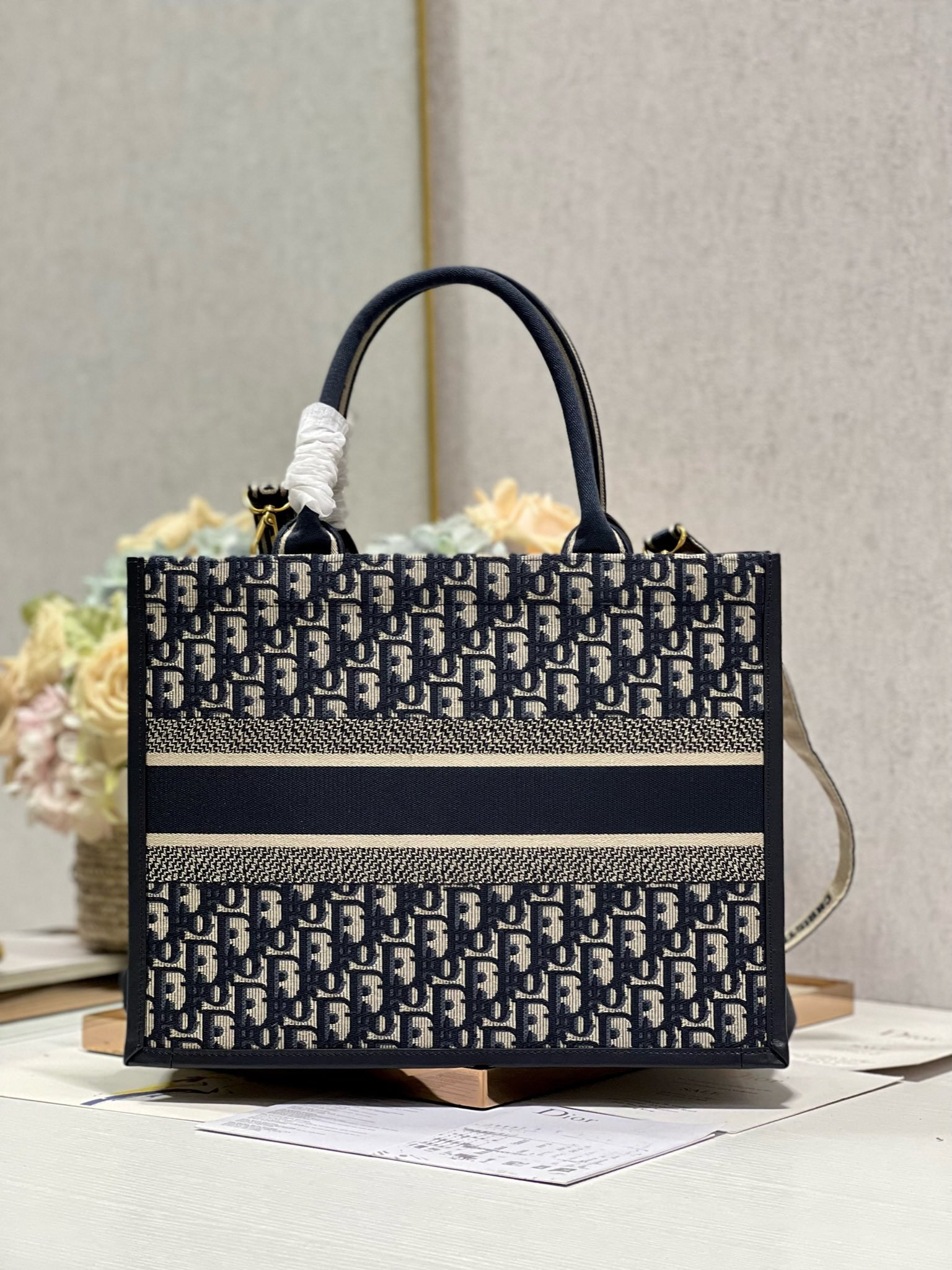 medium D*or book tote ecru and blue D*or oblique embroidery 14 x 11 x 6.5 inches