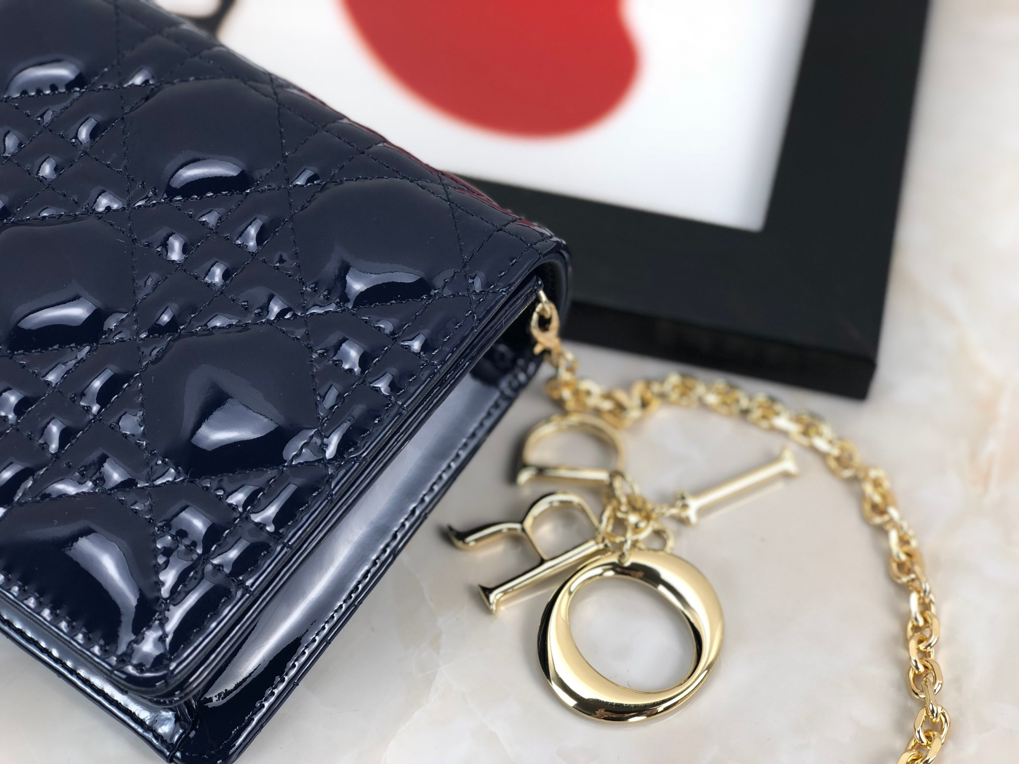 lady D*or pouch navy patent cannage calfskin 8.5 x 4.5 x 1 inches