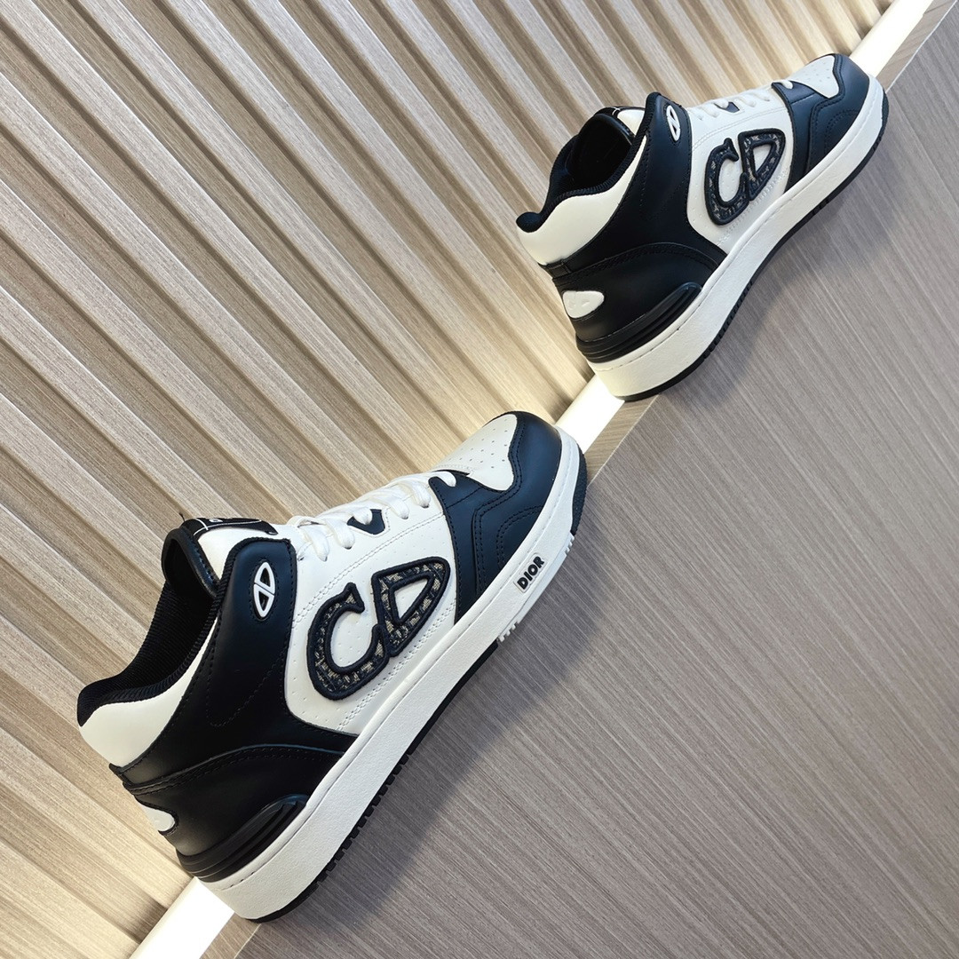 ua D*or b57 mid-top sneaker black and white