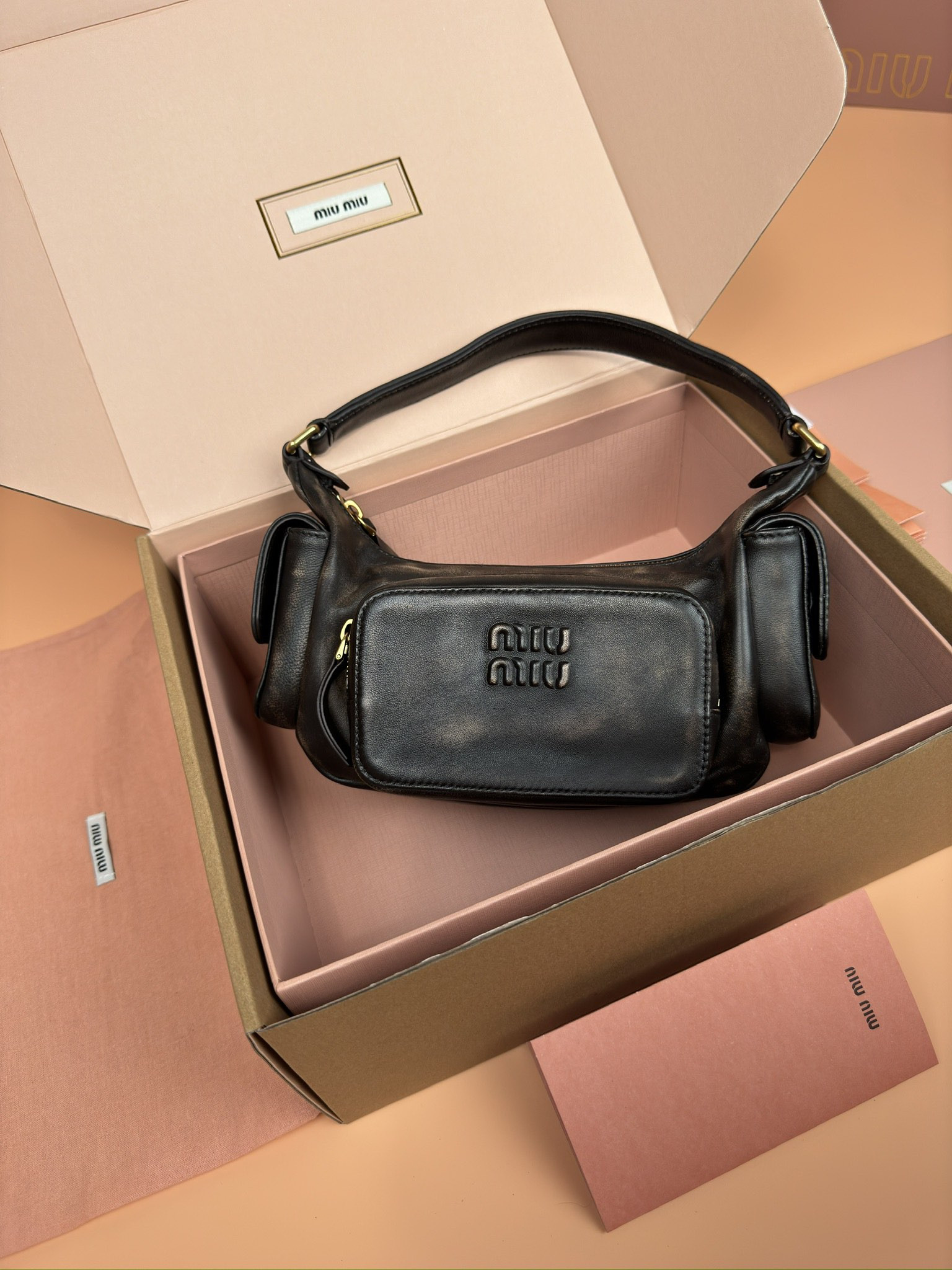 Miu Miu Hobo Nappa leather pocket bag 12x21x6cm