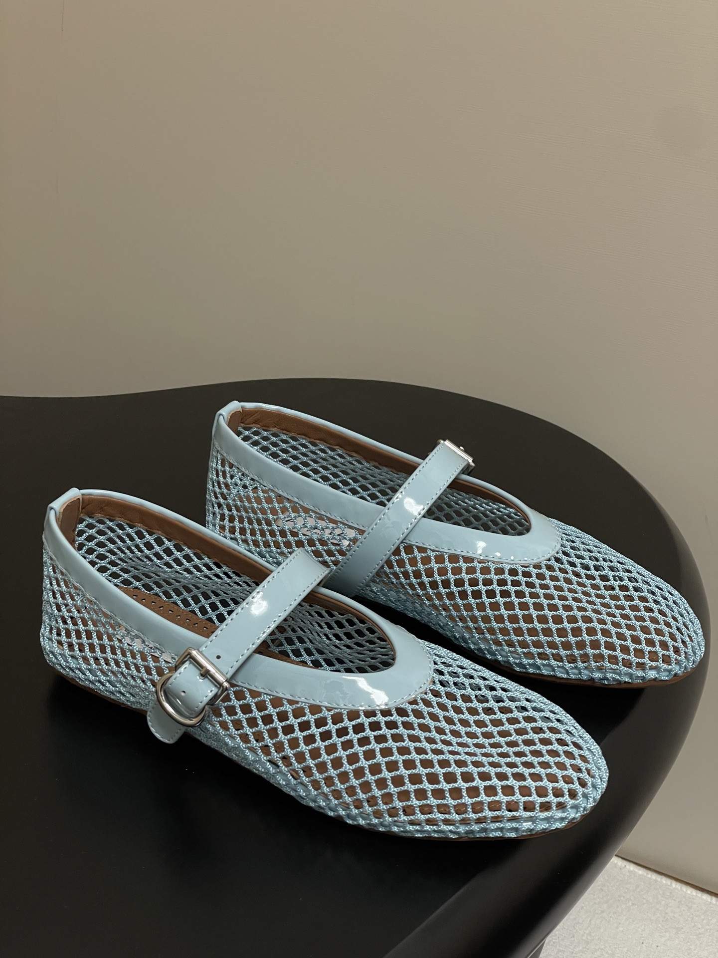 UA ALAÏA BALLET FLATS IN FISHNET